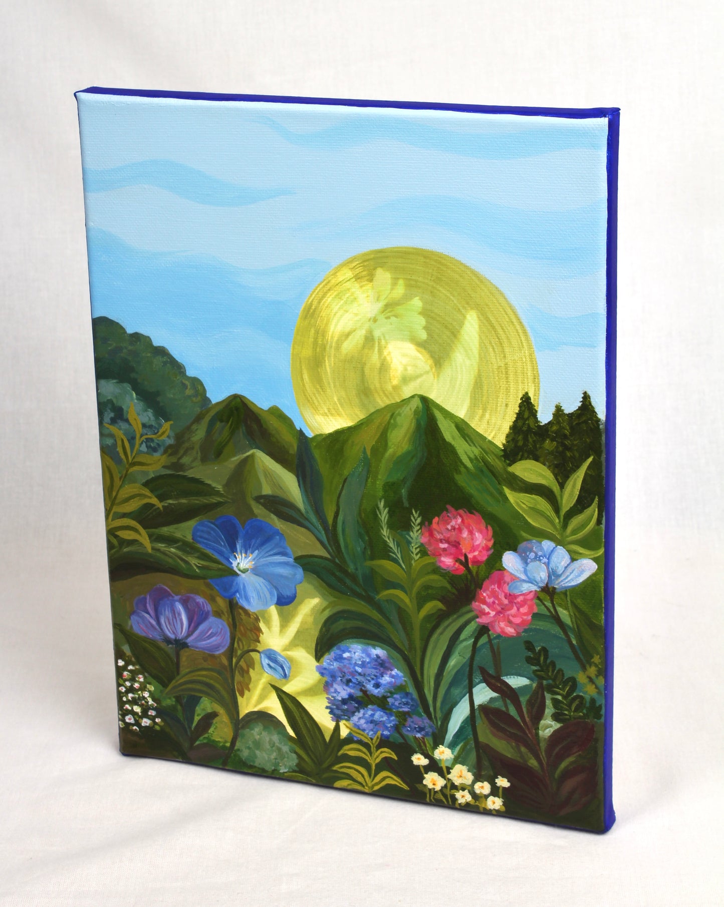 Original artwork of a sunlit garden with flowers and trees highlighting the cobalt blue border.